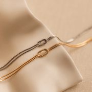 Pulsera Nudo disponible en oro y plata