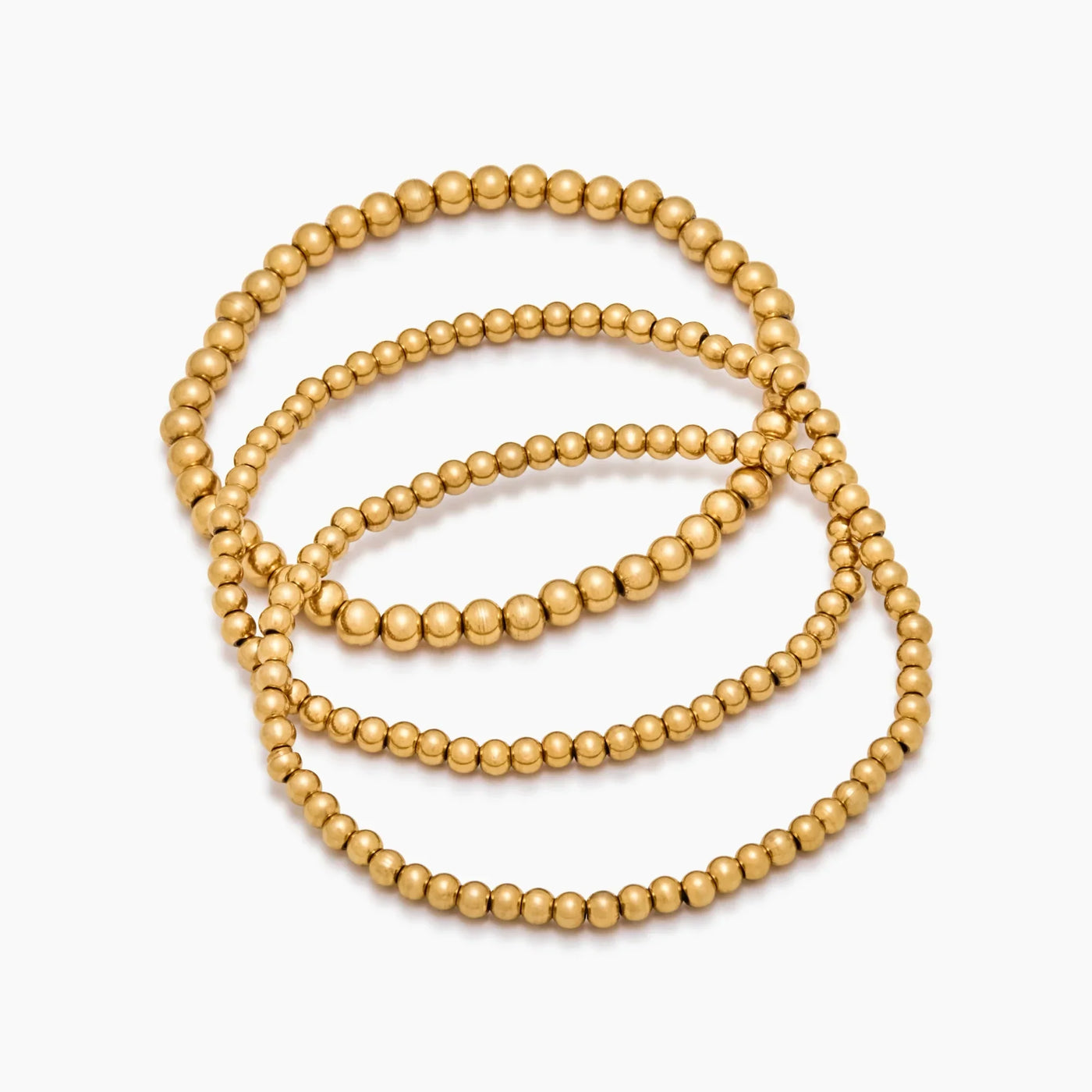 Set de tres pulseras doradas de esferas Oriana