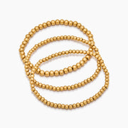 Set de tres pulseras doradas de esferas Oriana