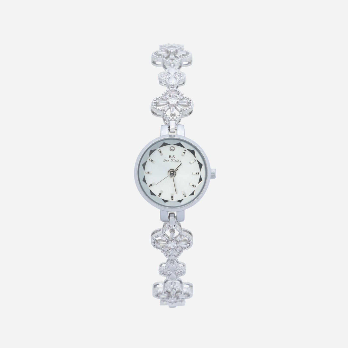 Reloj Floral Dalia plateado con esfera redonda sobre fondo claro