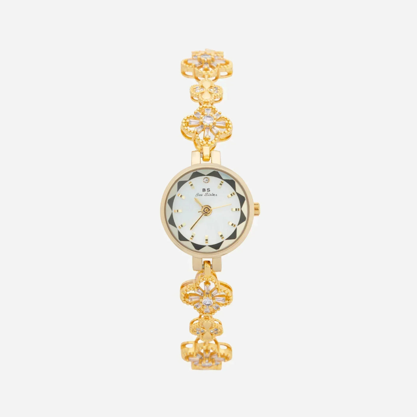 Reloj Floral Dalia dorado con esfera redonda sobre fondo claro